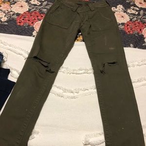 Army green distressed skinnies
